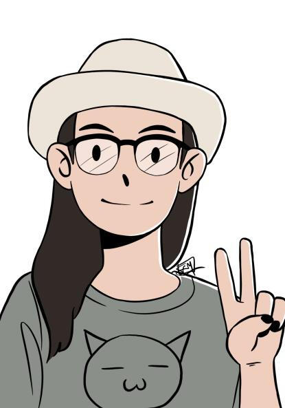 A portrait of a smiling person holding up a peace sign with black nail polish. They wear a beige hat, glasses, and a gray t-shirt with a cartoon cat's face. They have light skin and long wavy dark brown hair. The background is white and watermarked FEM.